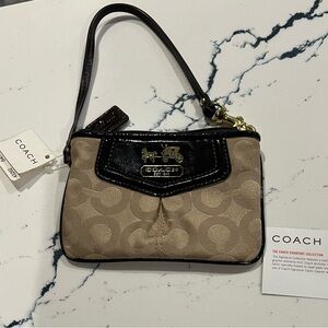 Coach Signature Collection wristlet with tag